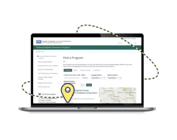 Computadora portátil con la página web del Programa de Prevención de la Diabetes de los CDC y un símbolo de un marcador de ubicación
